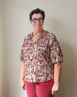 Damesbloes met half knopenpad