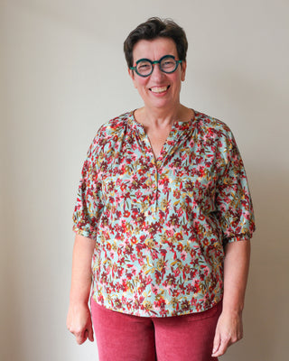 Damesbloes met half knopenpad