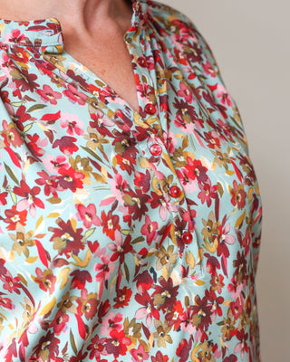 Damesbloes met half knopenpad